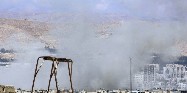 DAMASCUS, SYRIA - OCTOBER 08: Smoke rises after the Assad regime forces airstirkes on Jobar district of Damascus, Syria on October 08, 2015. (Photo by Ala Muhammed/Anadolu Agency/Getty Images)