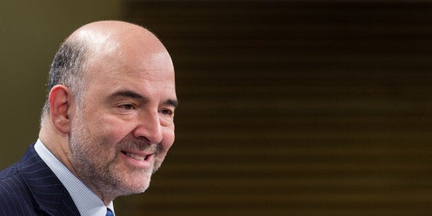 EU Commissioner for Economic and Financial Affairs, Taxation and Customs Pierre Moscovici addresses the media on the spring economic forecast at the European Commission headquarters in Brussels on Tuesday, May. 5, 2015. The European Union on Tuesday nudged up its forecast for economic growth across the 19-country eurozone despite a much gloomier outlook for Greece. (AP Photo/Geert Vanden Wijngaert)