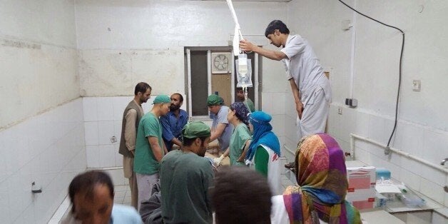 KUNDUZ, AFGHANISTAN -OCTOBER 03: Doctors Without Borders (MSF) staff are seen during a surgery after a US airstrike on MSF hospital in Kunduz, Afghanistan on October 03, 2015. An Afghan health official has said a U.S. air strike early Saturday morning in the northern city of Kunduz has killed 9 people and wounded 37 people, including 19 MSF staff. (Photo by MSF/Pool/Anadolu Agency/Getty Images)