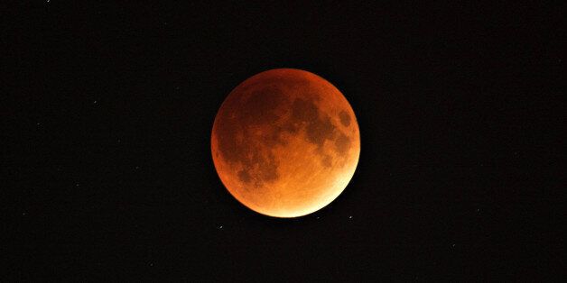 MONTREAL, Sept. 28, 2015-- A blood and supermoon is seen across Canada with clear skies in Montreal, Canada on the night of Sept. 27, 2015. Astronomers claimed a blood moon would return in 33 years. (Xinhua/Andrew Soong via Getty Images)