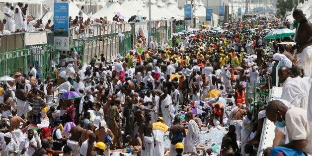 Muslim pilgrims and rescuers gather around people who were crushed by overcrowding in Mina, Saudi Arabia during the annual hajj pilgrimage on Thursday, Sept. 24, 2015. Hundreds were killed and injured, Saudi authorities said. The crush happened in Mina, a large valley about five kilometers (three miles) from the holy city of Mecca that has been the site of hajj stampedes in years past. (AP Photo)