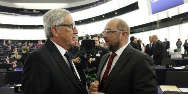 STRASBOURG, FRANCE - SEPTEMBER 9: President of the European Commission Jean-Claude Juncker and President of the European Parliament Martin Schulz (R)greet one another in the plenary room of the European Parliament on September 9, 2015 in Strasbourg, France. The 2015 State of the Union speech by EU Commissions President takes place in a decisive year marked by the Greek debt crisis, the asylum and immigration crisis as well as international geopolitical challenges. (Photo by Michele Tantussi/Getty Images)