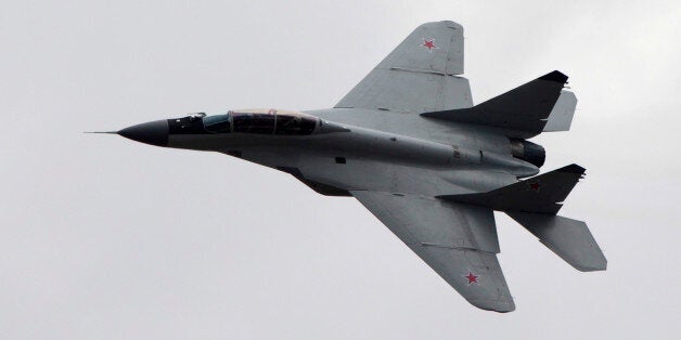 FILE - In this Saturday, Aug. 11, 2012 file photo, a Russian MiG-29 plane flies during a celebration marking the Russian air force's 100th anniversary in Zhukovsky, outside Moscow, Russia. The Syrian air force has destroyed two of three jets seized and reportedly test flown over Aleppo by the Islamic State group last week, according to Omran al-Zoubi, the country's information minister who spoke on Syrian TV late Tuesday, Oct. 21. 2014. Al-Zoubi said that Syrian aircraft bombed the jets as they