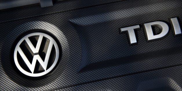 The logo of German car maker Volkswagen (VW) is seen on a VW Golf car in Milton Keynes, north of London, on October 2, 2015. Paris prosecutors have launched a preliminary investigation into possible fraud over the pollution-cheating software installed in diesel engines by German auto giant Volkswagen, a judicial source told AFP on October 2, 2015. AFP PHOTO / FRANCK FIFE (Photo credit should read FRANCK FIFE/AFP/Getty Images)