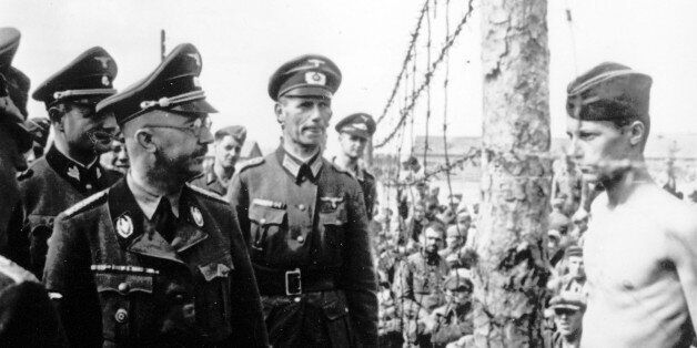 This undated photograph shows the Head of the Nazi German SS and Gestapo, Heinrich Himmler, as he inspects a German prisoner of war camp at an unknown location in the Soviet Union. (AP Photo)