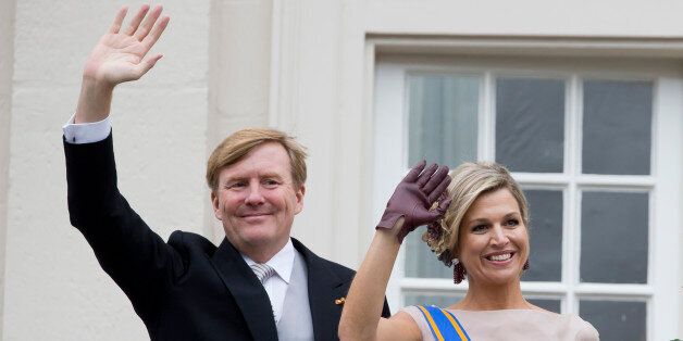 THE HAGUE, NETHERLANDS - SEPTEMBER 15: King Willem-Alexander and Queen Maxima of The Netherlands wave from the balcony of The Noordeinde Palace during Prinsjesdag (Prince's Day) on September 15, 2015 in The Hague, Netherland. (Photo by Julian Parker/UK Press via Getty Images)