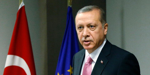 Turkish President Recep Tayyip Erdogan waits for the arrival of European Council President Donald Tusk prior to a meeting at the EU Council building in Brussels on Monday, Oct. 5, 2015. Erdogan is on a two-day visit to meet Belgian and EU officials. (Francois Lenoir, Pool photo via AP)