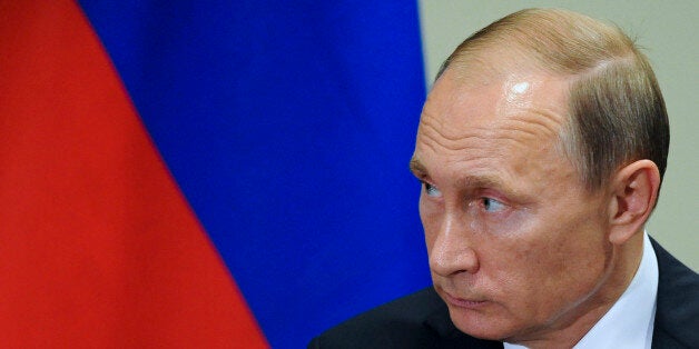 Russian President President Vladimir Putin listens to United Nations Secretary-General Ban Ki-moon after the 70th session of the United Nations General Assembly at U.N. headquarters, New York, Monday, Sept. 28, 2015. (Mikhail Klimentyev, RIA-Novosti, Kremlin Pool Photo via AP)