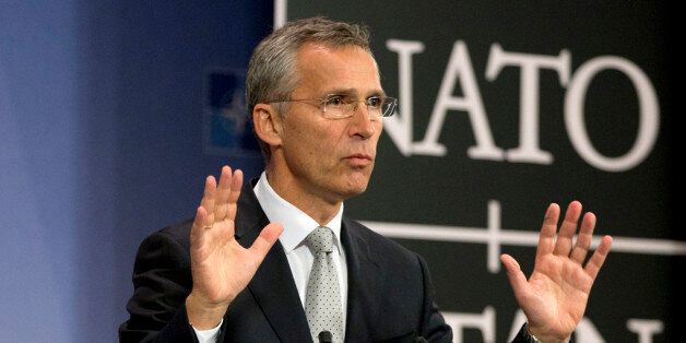 NATO Secretary General Jens Stoltenberg speaks during a media conference at NATO headquarters in Brussels on Tuesday, Oct. 6, 2015. NATO defense ministers will meet on Thursday, Oct. 8, 2015 to discuss, among other issues, the situation after a Russian fighter jet entered Turkish airspace from Syria over the weekend. (AP Photo/Virginia Mayo)