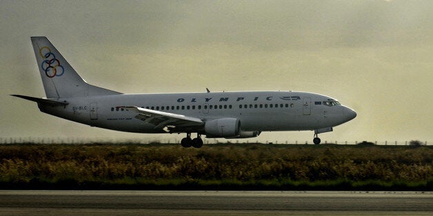 The boeing 737-300 of Greek Olympic ariways is seen before taking off from Cyprus to re-enact the course of a Cypriot airliner that crashed near Athens on Aug. 14, killing all 121 people on board, in Larnaca international airport in southern Cyprus 45 kilometers (28 miles) from the capital of Nicosia on Monday, Dec. 19, 2005. The Helios Airways Boeing 737-300 lost cabin pressure and ran out of fuel before slamming into a hillside outside Grammatiko, a village 40 kilometers, or 25 miles, north of the Greek capital. It had been heading from Larnaca to Prague, with a stop at Athens. (AP Photo/Petros Karadjias)