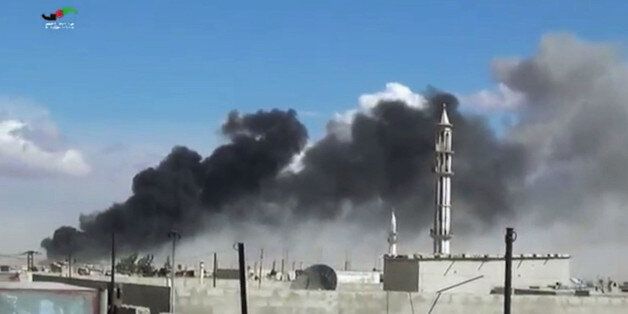 In this image made from video provided by Homs Media Centre, which has been verified and is consistent with other AP reporting, smoke rises after airstrikes by military jets in Talbiseh of the Homs province, western Syria, Wednesday, Sept. 30, 2015. Russian military jets carried out airstrikes in Syria for the first time on Wednesday, targeting what Moscow said were Islamic State positions. U.S. officials and others cast doubt on that claim, saying the Russians appeared to be attacking oppositio