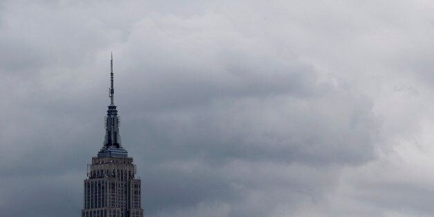 The Empire State Building is seen from Pier A Park on Wednesday, Sept. 30, 2015, in Hoboken, N.J. Officials are taking precautions for the rest of the week as forecasters closely follow Hurricane Joaquin. (AP Photo/Julio Cortez)