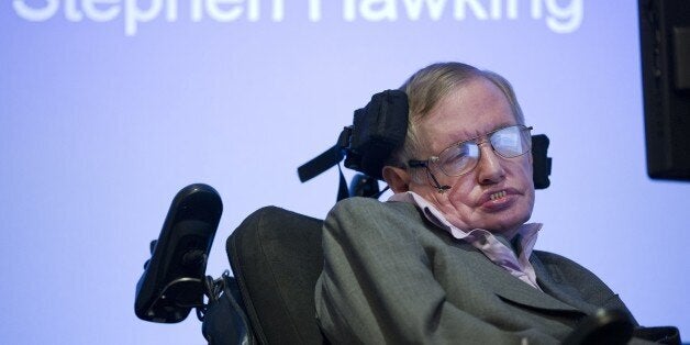 British theoretical physicist professor Stephen Hawking speaks to members of the media at a press conference in London on December 2, 2014. The system that helps Stephen Hawking communicate with the outside world will be made available online from January in a move that could help millions of motor neurone disease sufferers, scientists said Tuesday. The wheelchair-bound theoretical physicist, who shot to international fame in the 1980s with his book 'A Brief History of Time', hailed the decision by US tech giant Intel at a press conference in London. AFP PHOTO / JUSTIN TALLIS (Photo credit should read JUSTIN TALLIS/AFP/Getty Images)