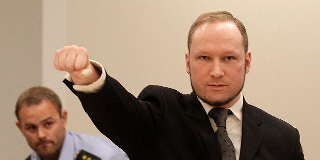 Mass murderer Anders Behring Breivik, makes a salute after arrives at the court room in a courthouse in Oslo Friday Aug. 24, 2012 . Breivik, who admitted killing 77 people in Norway last year, declared sane and sentenced to prison for bomb and gun attacks. (AP Photo/Frank Augstein)