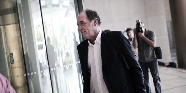Greek Economy Minister Giorgos Stathakis arrives for a meeting with representatives of the International Monetary Fund at a hotel in Athens, August 9, 2015. Greece and its creditors resumed talks in Athens on August 9, 2015 with both sides indicating that the terms of a third bailout will be finalised in short order. AFP PHOTO / ANGELOS TZORTZINIS (Photo credit should read ANGELOS TZORTZINIS/AFP/Getty Images)