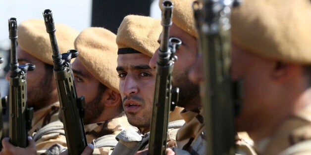 Iranian army troops conclude their march in a military parade marking the 35th anniversary of Iraq's 1980 invasion of Iran, in front of the shrine of late revolutionary founder Ayatollah Khomeini, just outside Tehran, Iran, Tuesday, Sept. 22, 2015. President Hassan Rouhani said Tuesday his countryâs military is the most reliable force to take on âterrorists in the regionâ _ a reference to the extremist Islamic State group while offering help to neighboring nations in case of fight against terrorism. (AP Photo/Vahid Salemi)