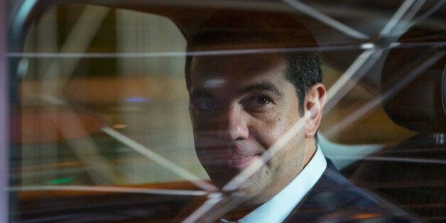 Alexis Tsipras, Greece's prime minister, looks out a car window as he departs following a European Union (EU) leaders summit in Brussels, Belgium, on Thursday, Sept. 24, 2015. European Union leaders vowed to boost humanitarian aid in response to the escalating refugee crisis after a summit that left them divided over how to police the bloc's frontiers. Photographer: Jasper Juinen/Bloomberg via Getty Images