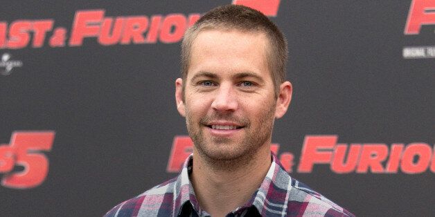 FILE - In this April 29, 2011 file photo, actor Paul Walker poses during the photo call of the movie