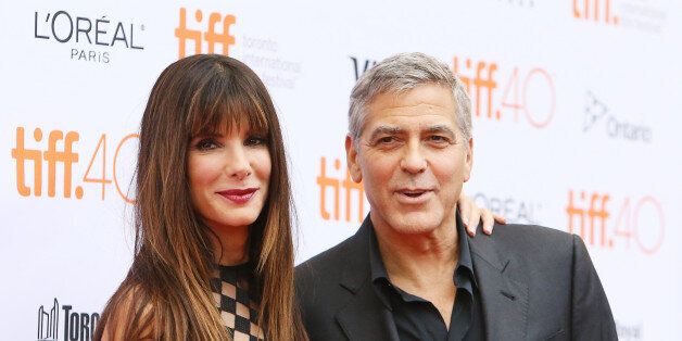 TORONTO, ON - SEPTEMBER 11: Sandra Bullock (L) and George Clooney arrive at 'Our Brand Is Crisis' premiere during 2015 Toronto International Film Festival held at Princess of Wales Theatre on September 11, 2015 in Toronto, Canada. (Photo by Michael Tran/Getty Images)