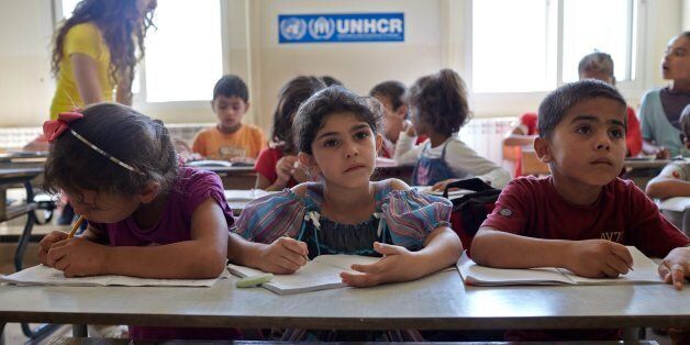 Syrian refugee students attend a class in an accelerated learning programme at public school in Kamed Al Louz in the Bekaa Valley, Lebanon. UNHCR/Photo by Shawn Baldwin