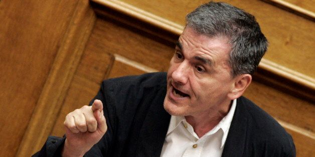 ATHENS, GREECE - JULY 22: Greek Finance Minister Euclid Tsakalotos addresses lawmakers during a parliamentary session on July 22, 2015 in Athens, Greece. Greece's leftist government tried on Wednesday to contain a rebellion in Prime Minister Alexis Tsipras' Syriza party ahead of a vote in the evening on reforms required to start talks on a rescue deal. (Photo by Milos Bicanski/Getty Images)