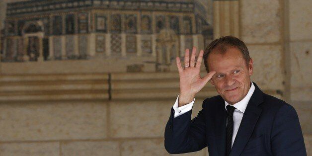 European Union President Donald Tusk waves as he arrives for a meeting with the Palestinian president in the West Bank city of Ramallah on September 9, 2015. AFP PHOTO / AHMAD GHARABLI (Photo credit should read AHMAD GHARABLI/AFP/Getty Images)