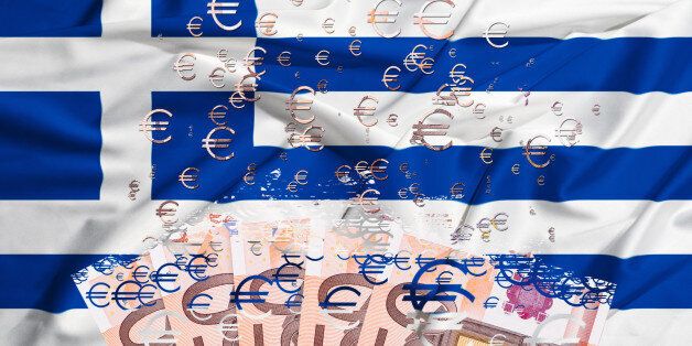euro banknote dissolving as a concept of economic crisis in greece