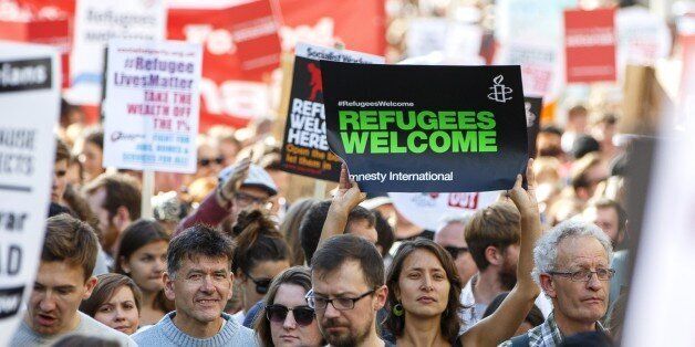 LONDON, UNITED KINGDOM - SEPTEMBER 12: Protesters attending a pro-refugee march in London, England on September 12, 2015. Pro-refugee demonstrators demand the UK government to help more refugees fleeing Syria. (Photo by Tolga Akmen/Anadolu Agency/Getty Images)