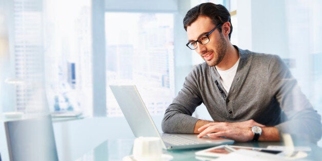 Man working using laptop in office