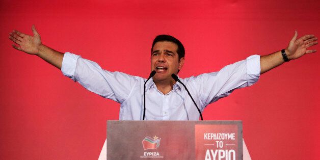 Syriza left-wing party leader and former Prime Minister Alexis Tsipras gestures as he delivers a pre-election speech to his supporters at Syntagma square in central Athens, Friday, Sept. 18, 2015. Opinion polls indicate a race too close to call, with Tsipras struggling to maintain the narrowest of leads over his main opponent, center-right New Democracy leader Vangelis Meimarakis. (AP Photo/Lefteris Pitarakis)