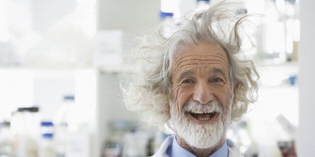 Senior Caucasian scientist with unruly hair in lab