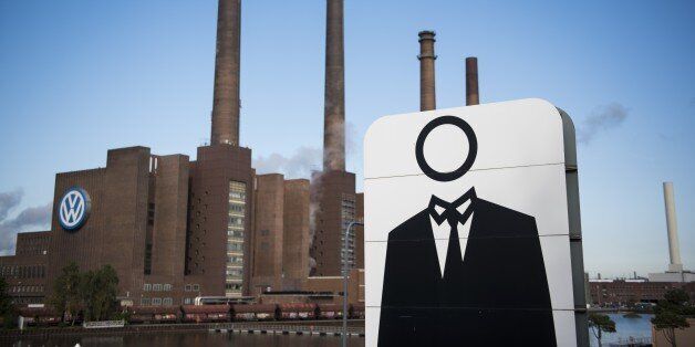 A giant poster with a faceless man is seen next to the headquarters of German car maker Volkswagen in Wolfsburg, central Germany, on September 23, 2015. Volkswagen chief Martin Winterkorn on September 22, 2015 offered his 'deepest apologies' for the pollution-cheating scandal engulfing the auto giant and threatening to tarnish Germany's industrial reputation. AFP PHOTO / ODD ANDERSEN (Photo credit should read ODD ANDERSEN/AFP/Getty Images)