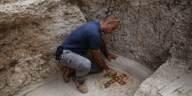 Israeli archeologist Dan Shachar, of the Israel Antiquities Authority, works on September 21, 2015 at the site of excavations where a large Mausoleum was recently uncovered located a short distance from the central Israeli city of Modiin. In recent weeks the Israel Antiquities Authority, together with local residents and young people, has been conducting an unusual archaeological excavation in search of the real location of the Tomb of the Maccabees. According to historical sources, the Maccabees Matityahu the Hasmonean and his five sons, from the ancient city of Modi'in, led the uprising against Greek rule and were responsible for cleansing the impurity from the Second Temple. AFP PHOTO/GALI TIBBON (Photo credit should read GALI TIBBON/AFP/Getty Images)