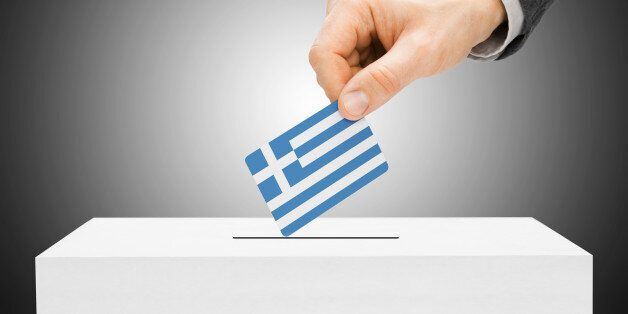Voting concept - Male inserting flag into ballot box - Greece