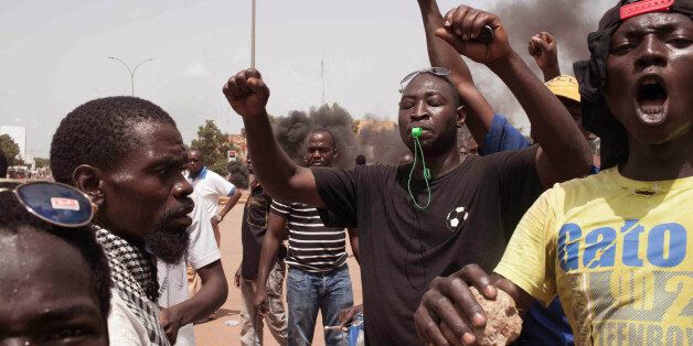 Burkina Faso protestors take to the streets in the city of Ouagadougou, Burkina Faso, Thursday, Sept. 17, 2015. While gunfire rang out in the streets, Burkina Fasoâs military took to the airwaves Thursday to declare it now controls the West African country, confirming that a coup had taken place just weeks before elections. (AP Photo/Theo Renaut)