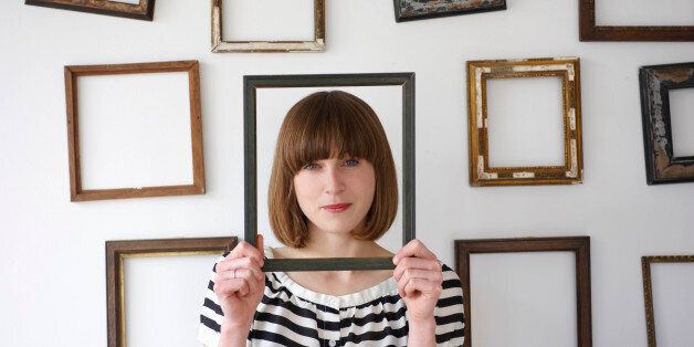 woman framed by picture frame
