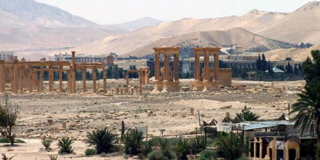 FILE - This file photo released on Sunday, May 17, 2015, by the Syrian official news agency SANA, shows the general view of the ancient Roman city of Palmyra, northeast of Damascus, Syria. Activists say Islamic State militants have destroyed a temple at Syria's ancient ruins of Palmyra. News that the militants blew up the Baalshamin Temple came after the extremists beheaded Palmyra scholar Khaled al-Asaad on Tuesday, hanging his bloodied body from a pole in the town's main square. (SANA via AP, File)