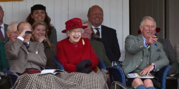 Photo by: KGC-42/STAR MAX/IPx 2015 9/5/15 Prince Philip The Duke of Edinburgh, Her Majesty Queen Elizabeth II and Charles The Prince of Wales at the Highland Games during the 2015 Braemar Gathering. (Braemar, Scotland, UK)