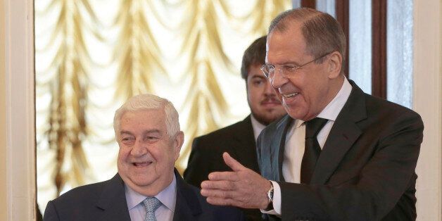 Russian Foreign Minister Sergey Lavrov, right, welcomes his Syrian counterpart Walid al-Mualem prior to a meeting in Moscow, Russia on Monday, June 29, 2015. (AP Photo/Ivan Sekretarev)