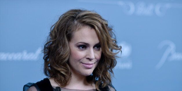 Alyssa Milano arrives at the 2014 UNICEF Ball on Tuesday, Jan. 14, 2014 in Beverly Hills, Calif. (Photo by Richard Shotwell Invision/AP)