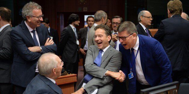 BRUSSELS, BELGIUM - JULY 13: German Finance Minister Wolfgang Schauble (2nd L), Luxembourg's Finance Minister Pierre Gramegna (L) and Eurogroup President Jeroen Dijsselbloem (2nd R) at the start of Eurogroup finance ministers meeting at the European Council headquarters in Brussels, Belgium on July 13, 2015. Eurozone finance ministers were to discuss a range of issues including the election of the Eurogroup president and the current situation affecting Greece. (Photo by Dursun Aydemir/Anadolu Agency/Getty Images)