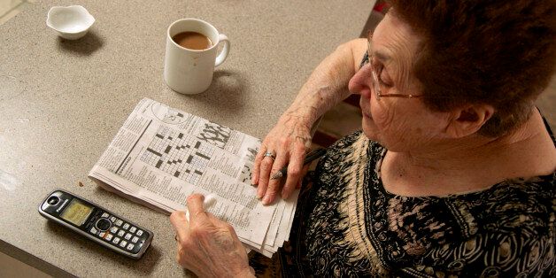 In this photo taken April 3, 2015, Eleanor Blum, 88, solves crossword puzzles with her wireless phone next to her in the Sherman Oaks area of Los Angeles. Jeri Vargas put her elderly mother on the âDo Not Callâ list years ago. So why is the 88-year-old woman with Alzheimerâs disease still getting several recorded phone calls a day pitching her everything from vacation cruises to medical alert devices and fire extinguishers? (AP Photo/Damian Dovarganes)