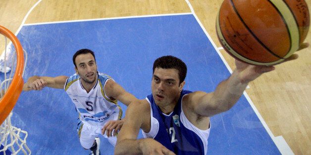 Greece's Konstantinos Tsartsaris, right, shoots as Argentina's Manu Ginobili defends during their men's quarterfinal basketball game at the Beijing 2008 Olympics in Beijing, Wednesday, Aug. 20, 2008. (AP Photo/Eric Gay, pool)