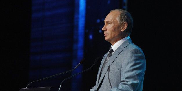 Russian President Vladimir Putin addresses teachers and students at the college for gifted children