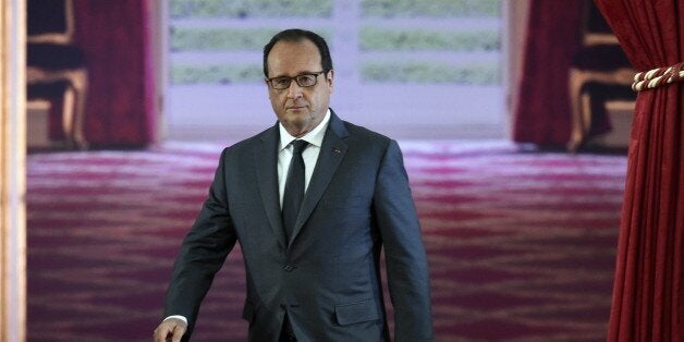 French President Francois Hollande arrives for his bi-annual press conference on September 7, 2015 at the Elysee presidential palace Paris. France will launch surveillance flights over Islamic State group positions in Syria from 8 September. 'I have asked the defence ministry that from tomorrow surveillance flights can be launched over Syria, allowing us to plan airstrikes against Daesh (the Islamic State group),' said Hollande. AFP PHOTO / ALAIN JOCARD (Photo credit should read ALAIN JOCARD/AFP/Getty Images)