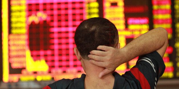 HAIKOU, CHINA - SEPTEMBER 02: (CHINA OUT) An investor observes stock market at a stock exchange hall on September 2, 2015 in Haikou, Hainan Province of China. Chinese shares dropped on Wednesday with the benchmark Shanghai Composite Index down 6.45 points, or 0.20 percent, to close at 3,160.17. The Shenzhen Component Index fell 107.72 points, or 1.06 percent, to close at 10,054.80. (Photo by ChinaFotoPress/ChinaFotoPress via Getty Images)