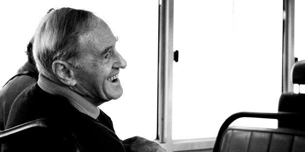 An laughing old man who sit with us during the journey.