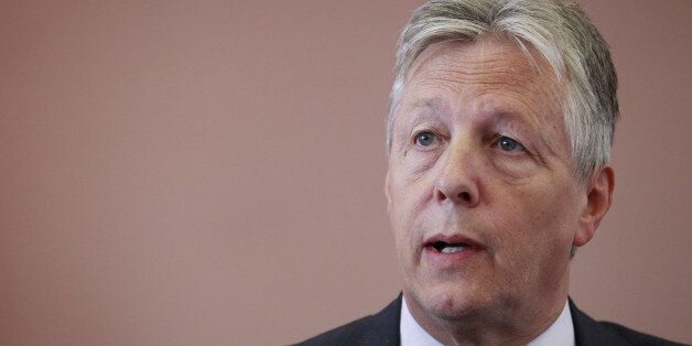 Northern Ireland First Minister Peter Robinson speaks to the media during a press conference in East Belfast, Northern Ireland, Thursday, July 10, 2014. The press conference was attended by members of the orange order and unionist and loyalist political parties where they called on the Northern Ireland secretary to set up a legal inquiry into marching issues in north Belfast and announced details of their planned protests for July 12th. (AP Photo/Peter Morrison)