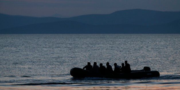 A dinghy with Syrian migrants is towed by a Greek coast guard patrol boat into the port of Kos, Greece, following a rescue operation in a part of the Aegean Sea between Turkey and Greece Sunday, May 31, 2015. Greece and Italy are the main points of entry into the European Union for refugees and economic migrants from the Middle East and Africa hoping to reach other European Union countries. (AP Photo/Petros Giannakouris)