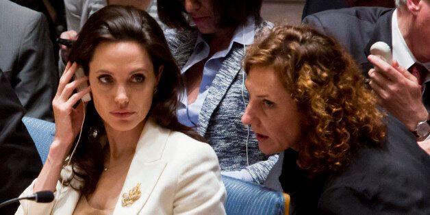U.N. Special Envoy for Refugees and Hollywood star Angelina Jolie, left, confers, during her appearance before the U.N. Security Council on Syria's refugee crisis, Friday, April 24, 2015. (AP Photo/Bebeto Matthews)